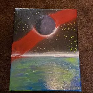 Homemade spray paint art of planet and water